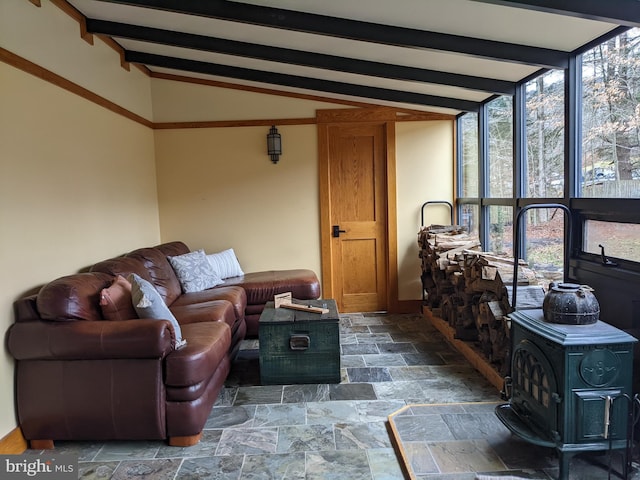 sunroom featuring vaulted ceiling with beams