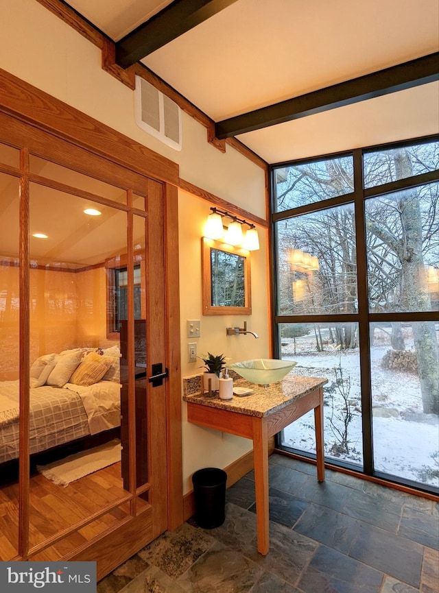 interior space with beamed ceiling and sink