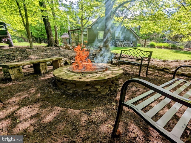 view of yard with an outdoor fire pit