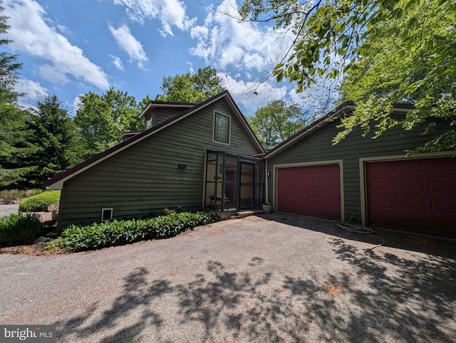 2 Yoakum Run Rd, Davis, WV 26260 - view of side of home featuring asphalt driveway and a garage