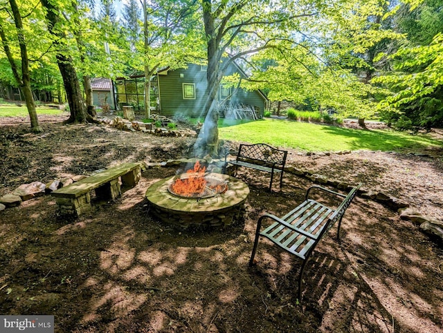 view of yard featuring a fire pit