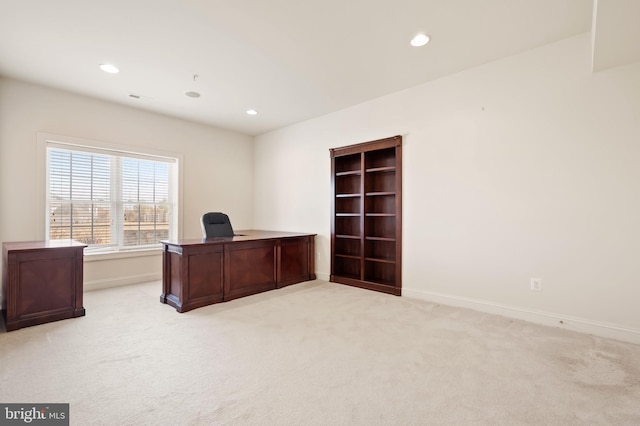 unfurnished office featuring recessed lighting, light colored carpet, visible vents, and baseboards