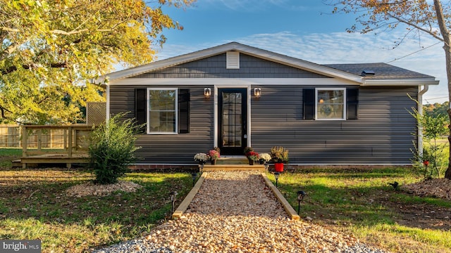 bungalow-style house with a wooden deck