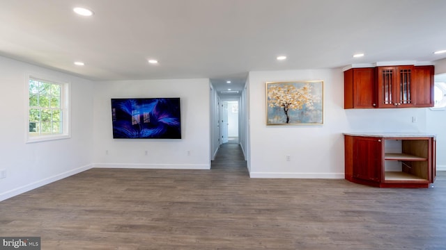 unfurnished living room with dark hardwood / wood-style floors