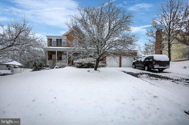 view of front of house with a garage and a porch