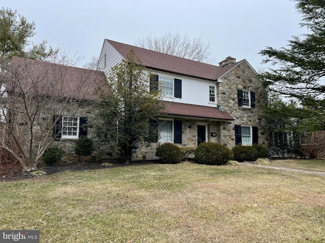 view of property with a front lawn