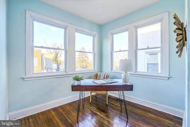 office area featuring dark wood finished floors and baseboards