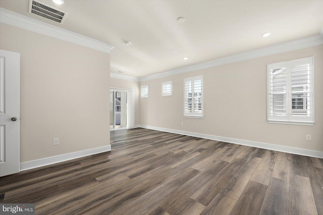 unfurnished room featuring dark wood-type flooring, baseboards, visible vents, ornamental molding, and recessed lighting