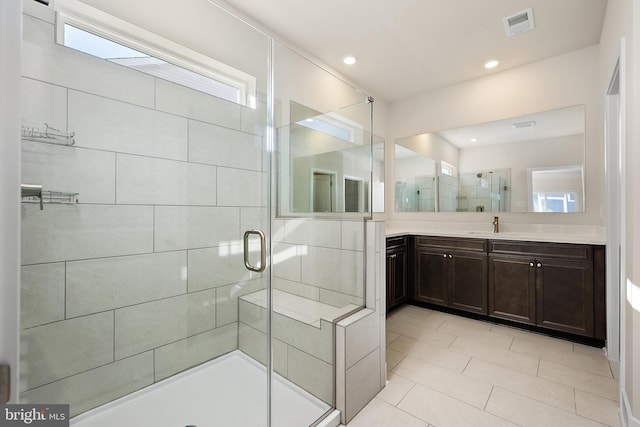 bathroom featuring a stall shower, tile patterned floors, vanity, visible vents, and recessed lighting