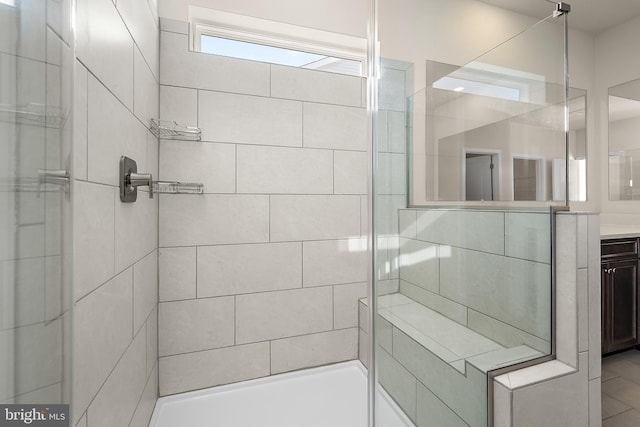 full bathroom featuring a stall shower and vanity