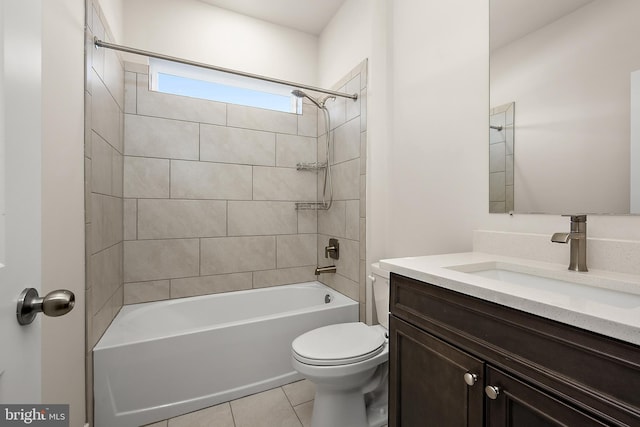bathroom featuring toilet, vanity, tile patterned flooring, and bathing tub / shower combination