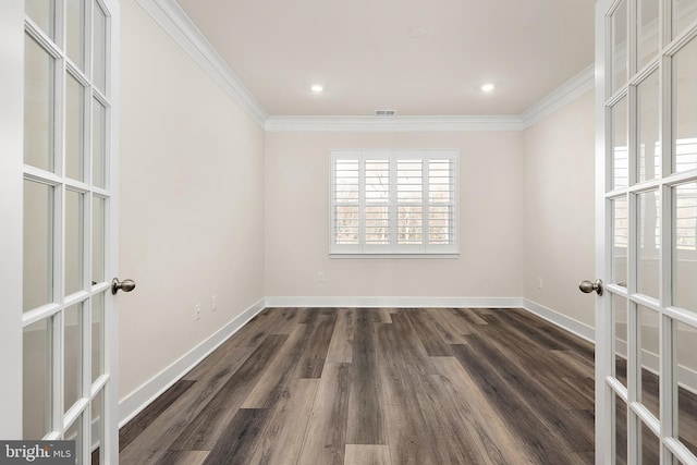 spare room with recessed lighting, french doors, ornamental molding, baseboards, and dark wood finished floors