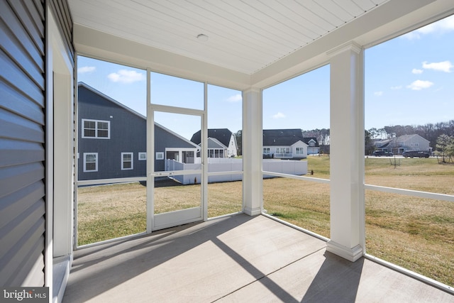 sunroom with a residential view