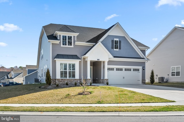 view of front of property featuring stone siding, central AC unit, a garage, a front lawn, and driveway