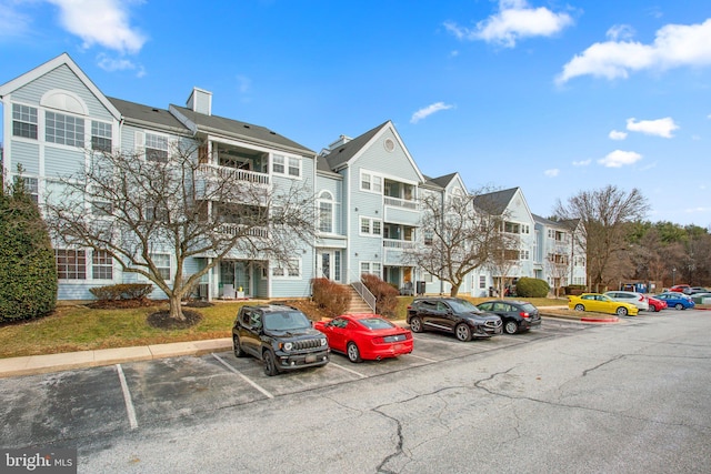 view of property featuring uncovered parking