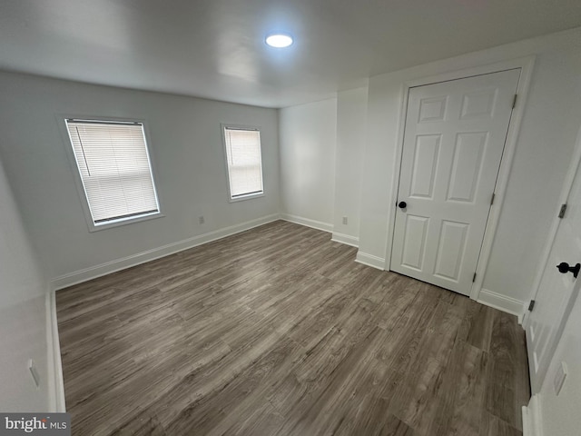 empty room featuring wood-type flooring