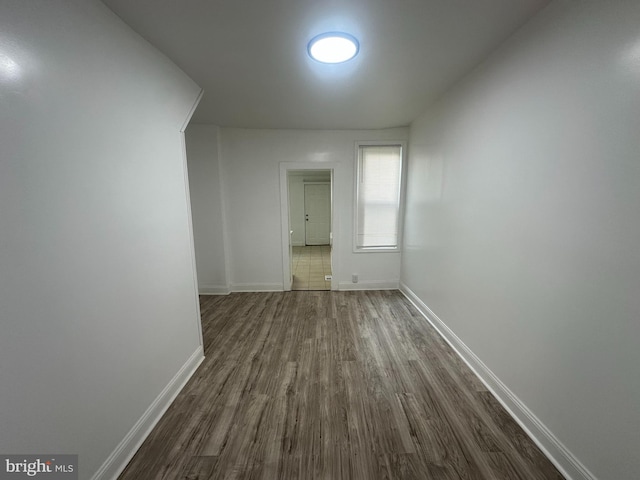 hallway featuring dark hardwood / wood-style flooring