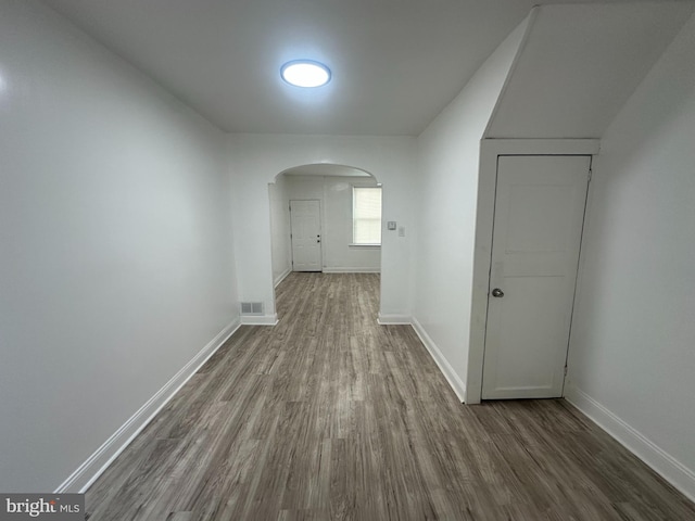 hallway featuring wood-type flooring