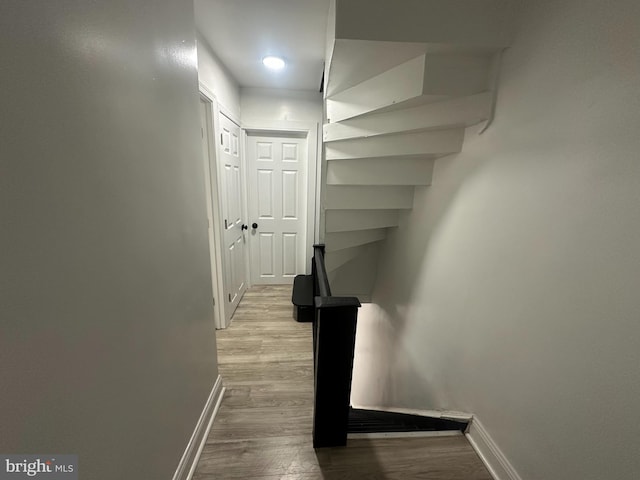 corridor with light hardwood / wood-style flooring