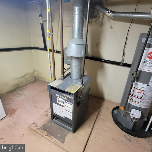 utility room with water heater