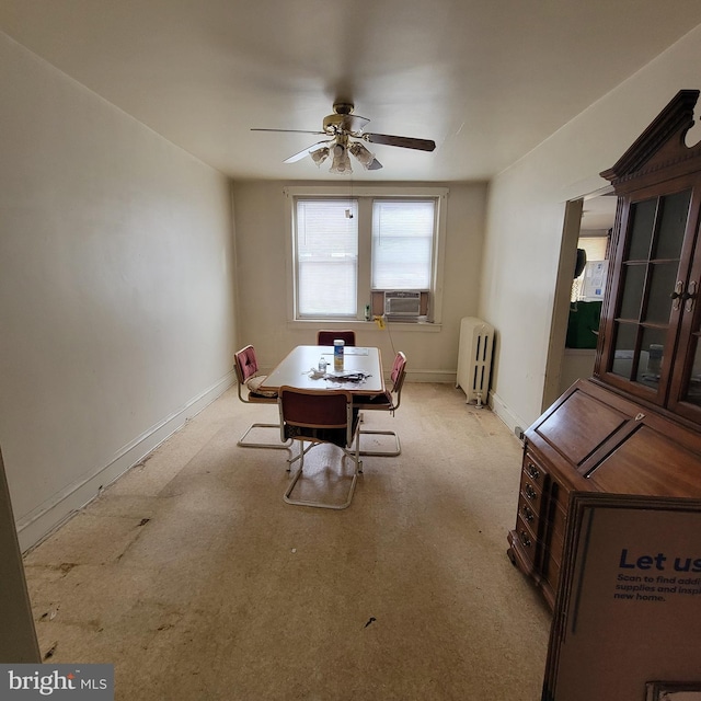 dining area featuring cooling unit, ceiling fan, and radiator