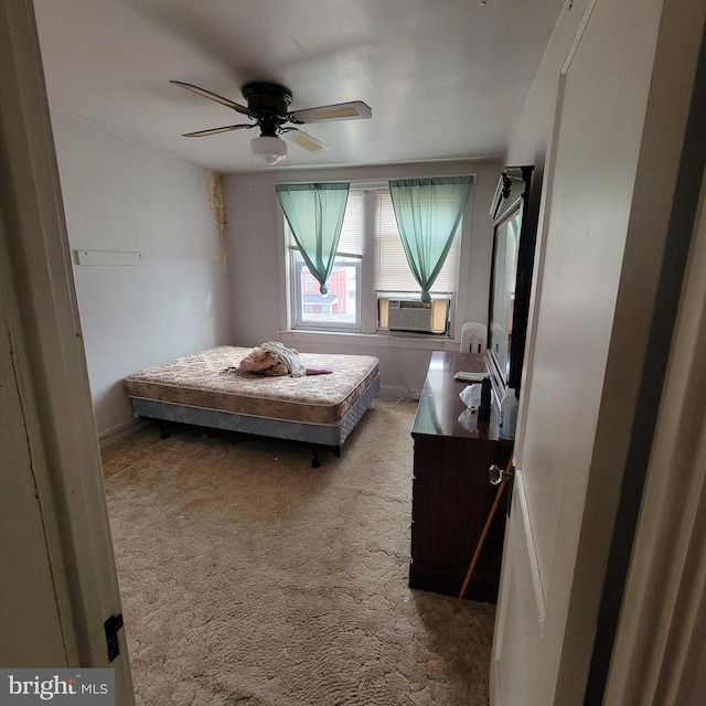 bedroom featuring cooling unit, ceiling fan, and carpet floors