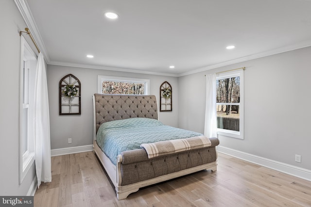 bedroom with ornamental molding and light wood-type flooring