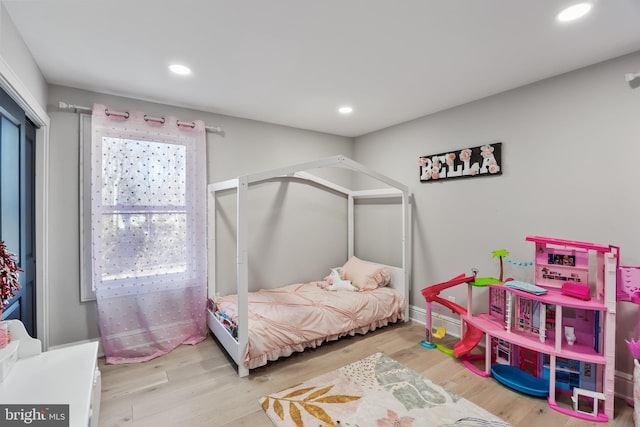 bedroom with light hardwood / wood-style flooring