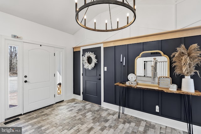 entrance foyer with an inviting chandelier