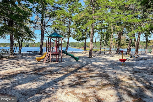 view of jungle gym featuring a water view