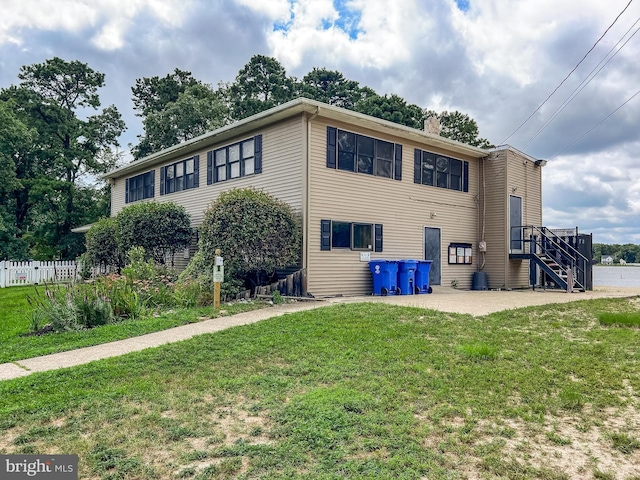 exterior space featuring a patio area and a front yard