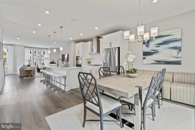 dining room featuring a notable chandelier and dark hardwood / wood-style floors