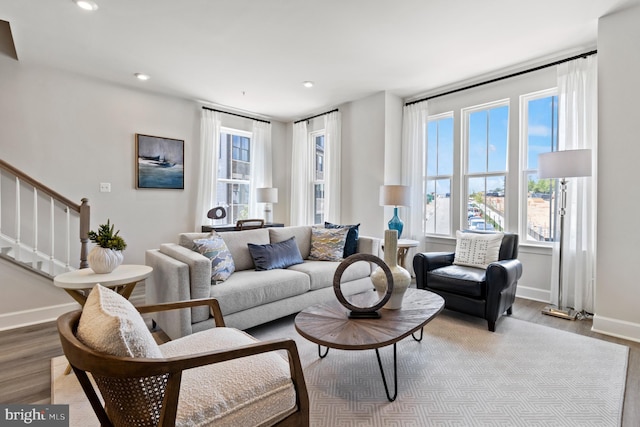 living room with plenty of natural light and light wood-type flooring