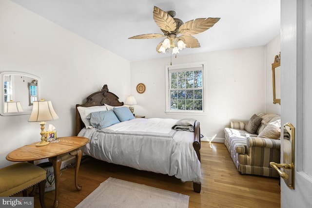 bedroom with a ceiling fan and light wood finished floors