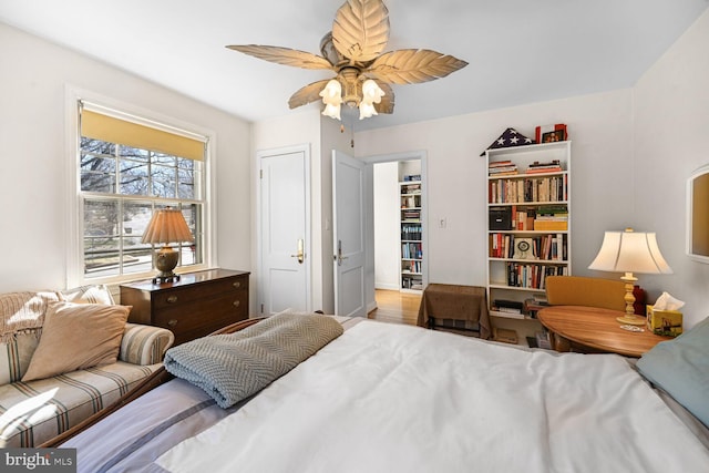 bedroom featuring ceiling fan and wood finished floors