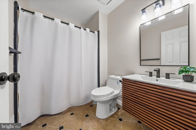 full bathroom with vanity, toilet, and tile patterned floors