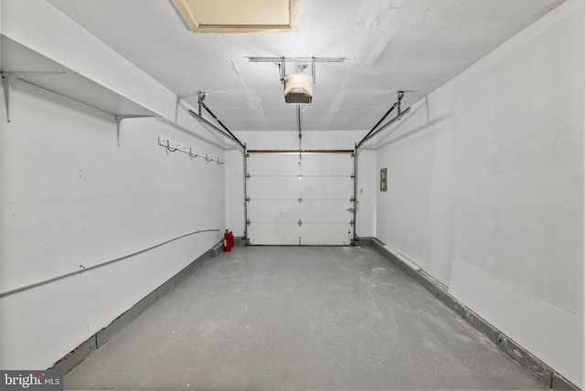 garage featuring electric panel and a garage door opener