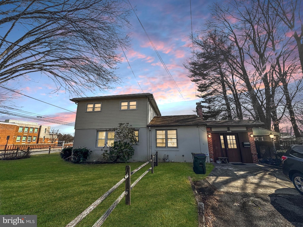 view of front of home with a lawn