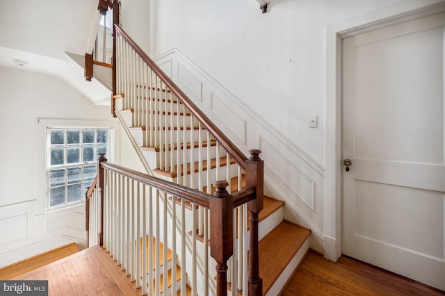 stairs with wood finished floors