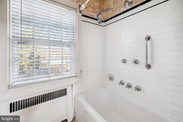 full bath featuring radiator and shower / bathing tub combination