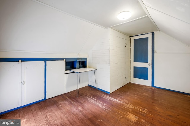 additional living space with lofted ceiling and dark wood finished floors