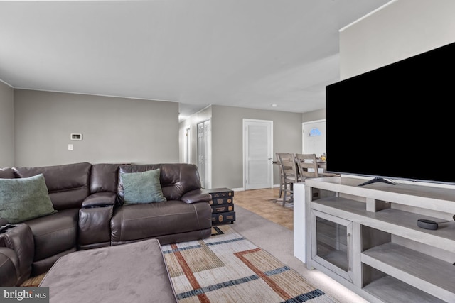 living room featuring light carpet