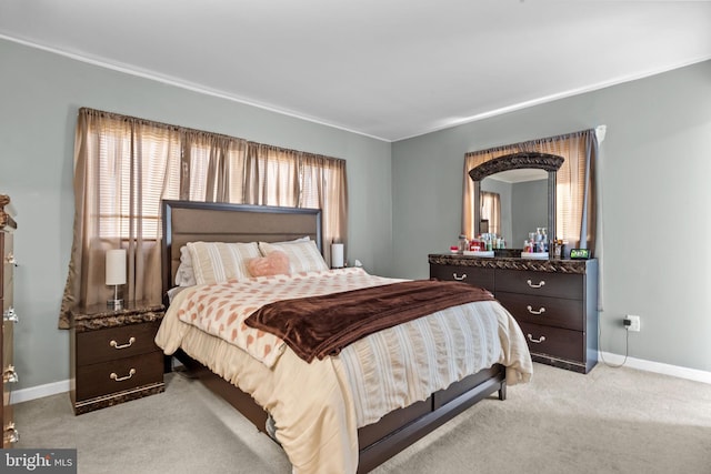 bedroom featuring light colored carpet