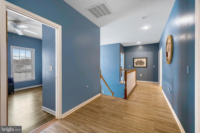 hall with light hardwood / wood-style flooring