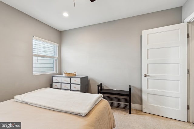 bedroom with recessed lighting and light colored carpet