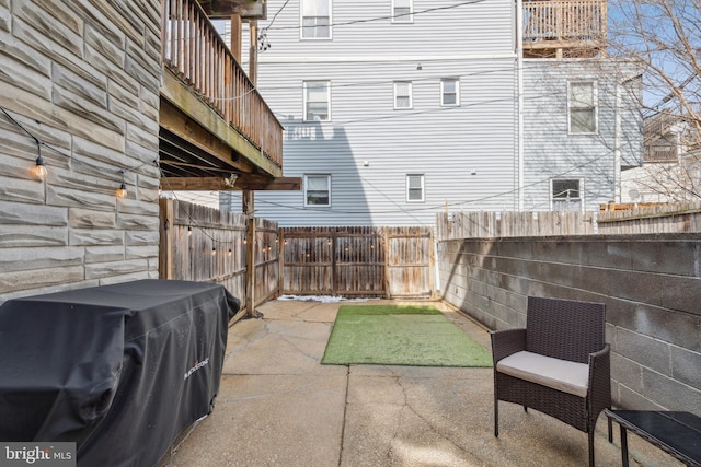 view of patio / terrace with a fenced backyard and area for grilling