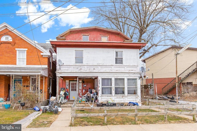 view of property featuring a porch