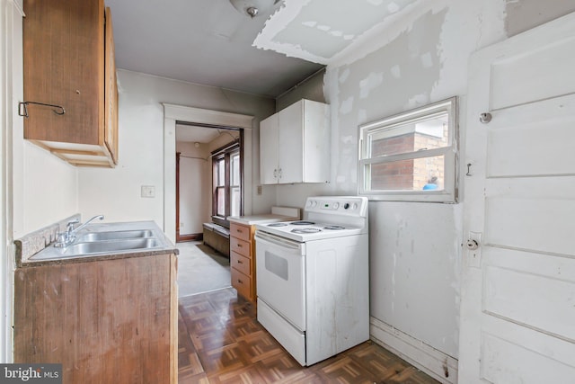 kitchen with white cabinetry, white electric range, sink, and dark parquet flooring