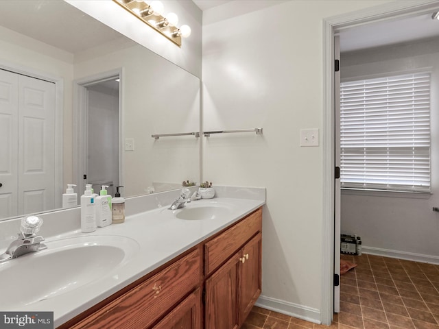 bathroom with tile patterned floors and vanity