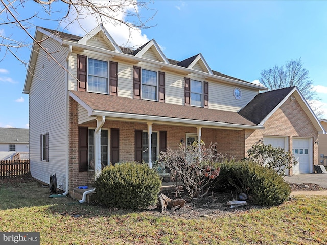 view of front of property with a garage and covered porch